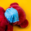 red teddy wearing blue face mask_MASKNE: 4 TIPS FOR FIGHTING MASK-WEARING CAUSED ACNES 